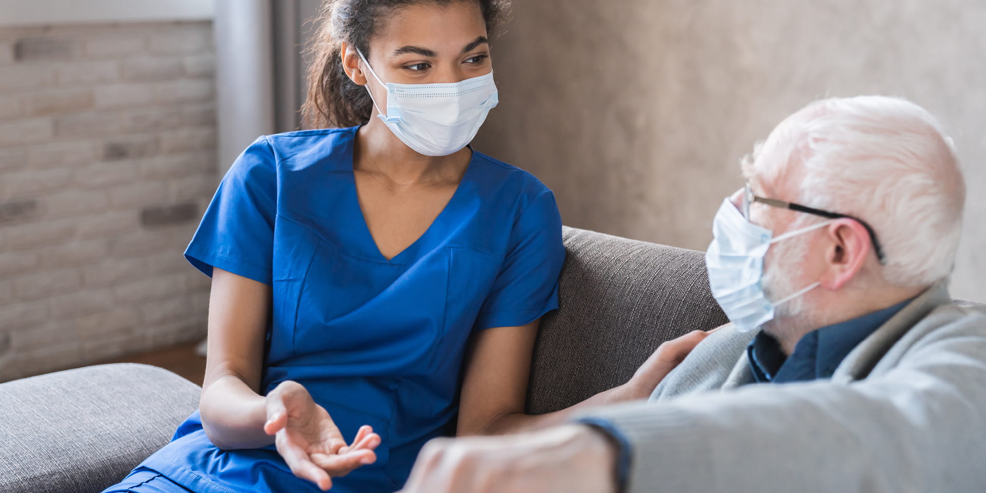 Nurse sitting with patient