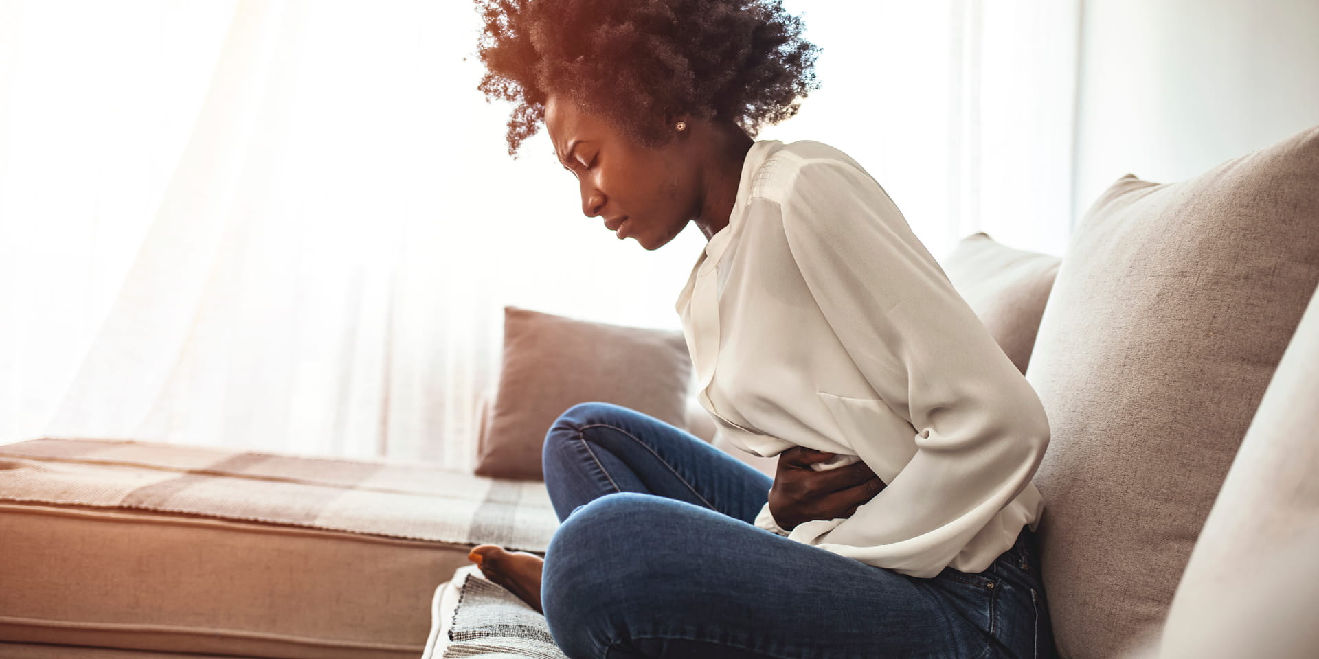 woman clutching stomach