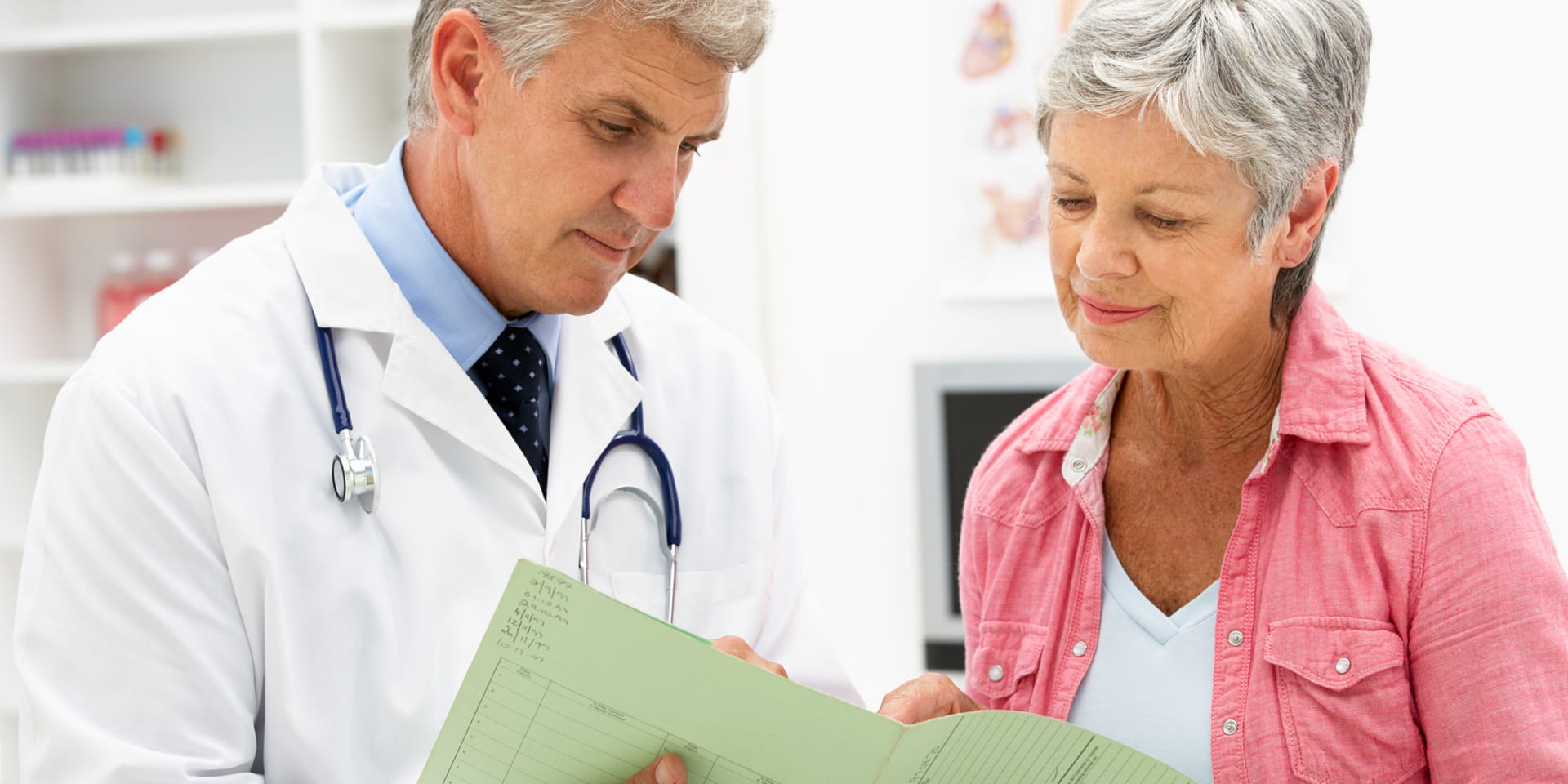 woman looking at information with her doctor