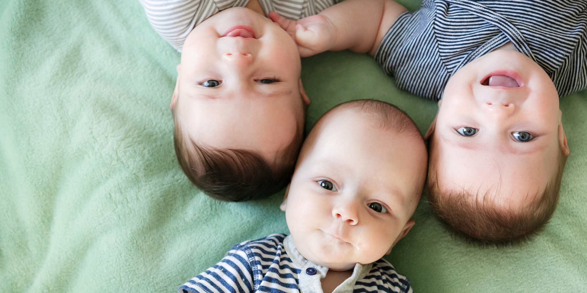 three babies laying together