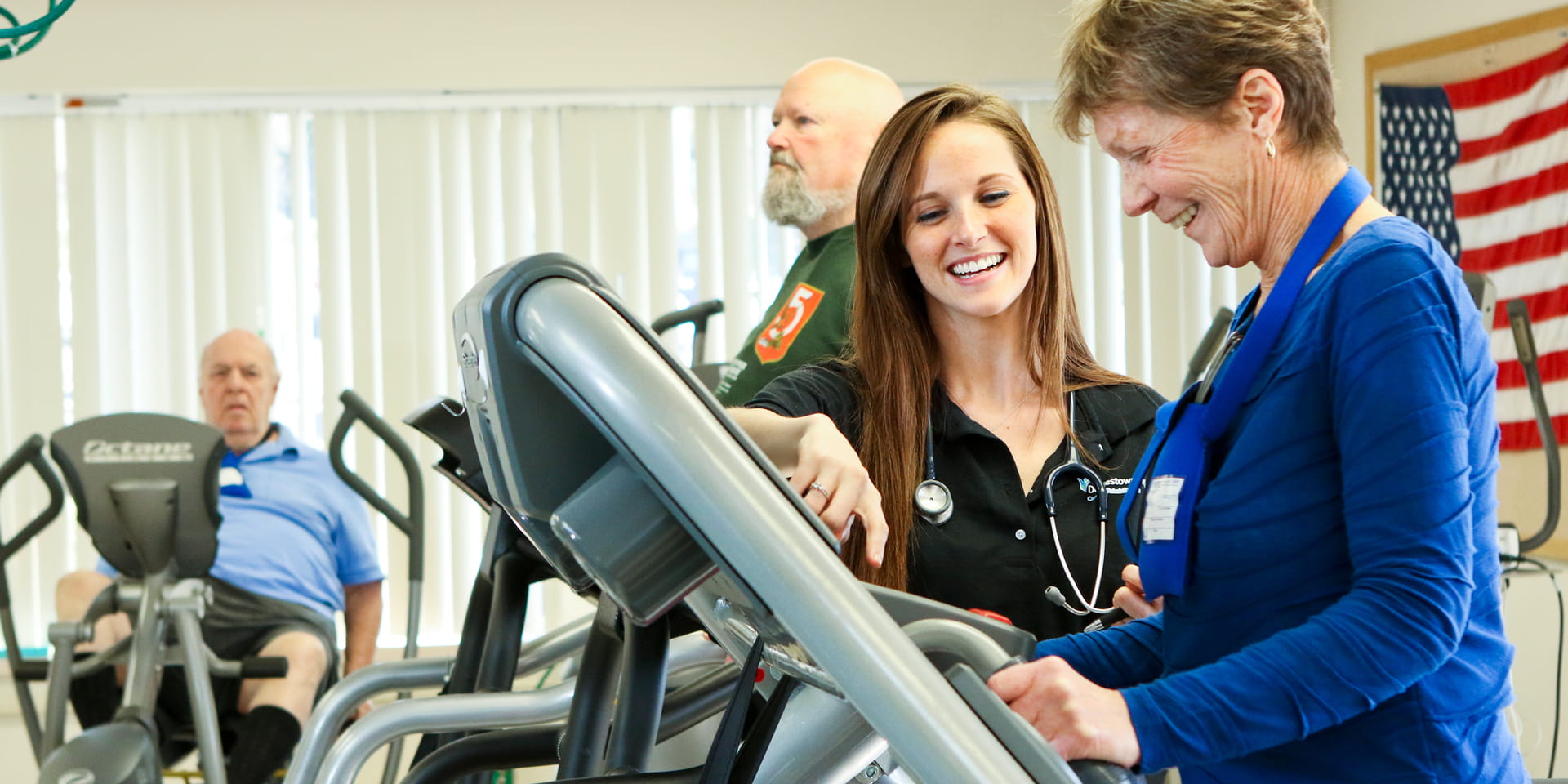 cardiac rehab therapist helping woman on treadmill | Doylestown Health