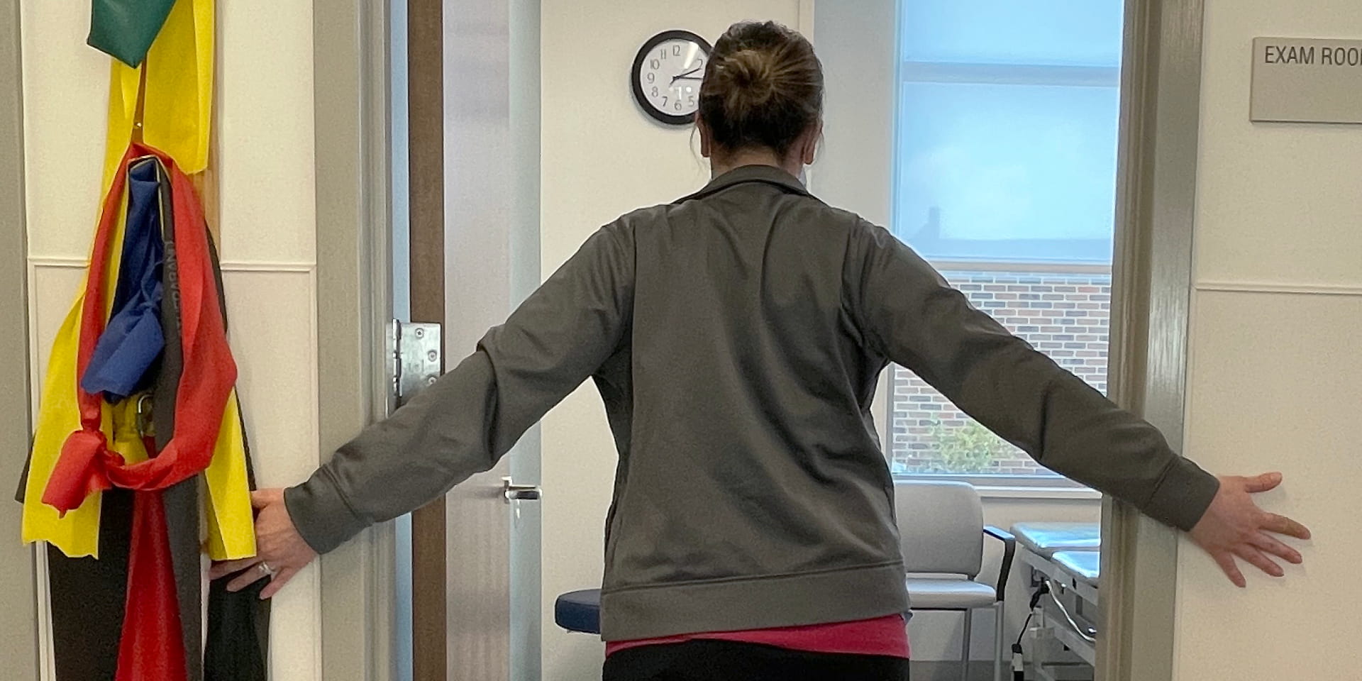 Doylestown Health demonstrates technique using door frame