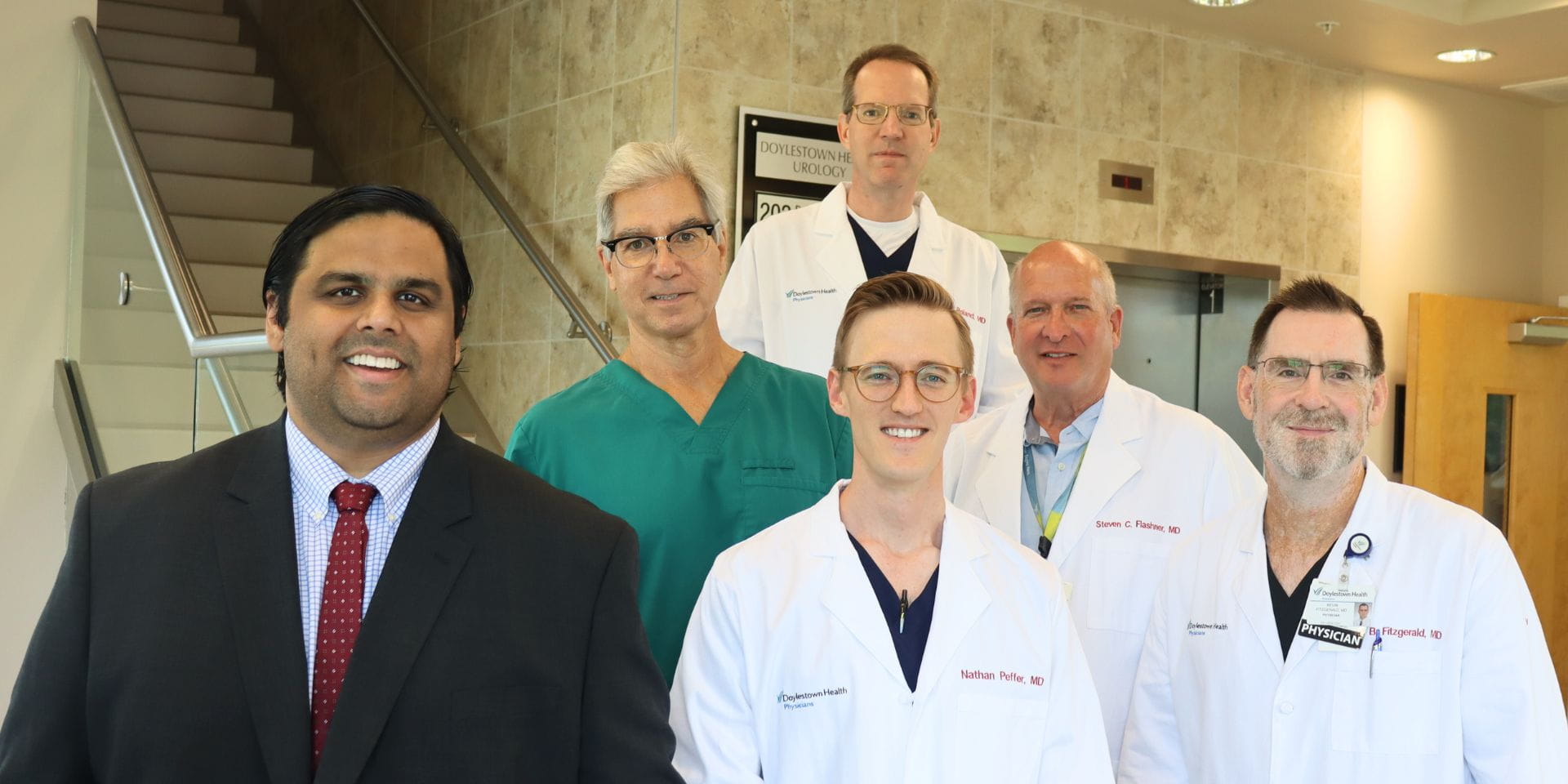 Urologists standing on stairs | Doylestown Health