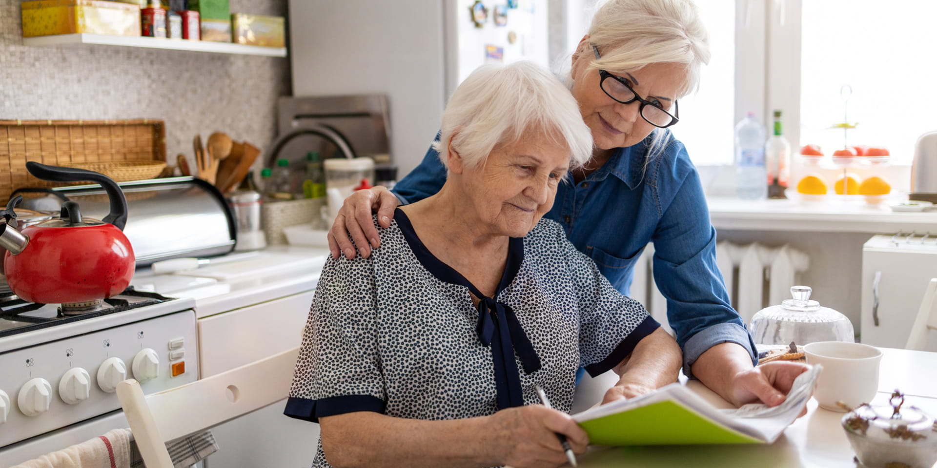 Two woman reviewing information 