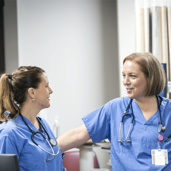 Nurses talking at the desk | Doylestown Health