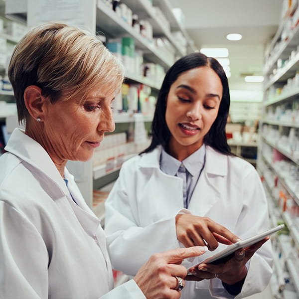 A pharmacy resident speaking with a program director | Doylestown Health