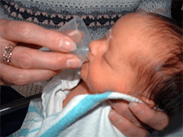 Mother cup feeding her baby | Doylestown Health