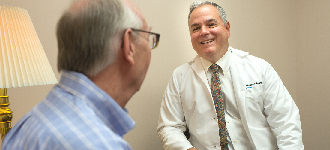 Colon and Rectal providers listening to a patient | Doylestown Health