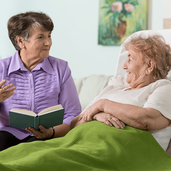 Heart to heart volunteers discussing a book | Doylestown Health