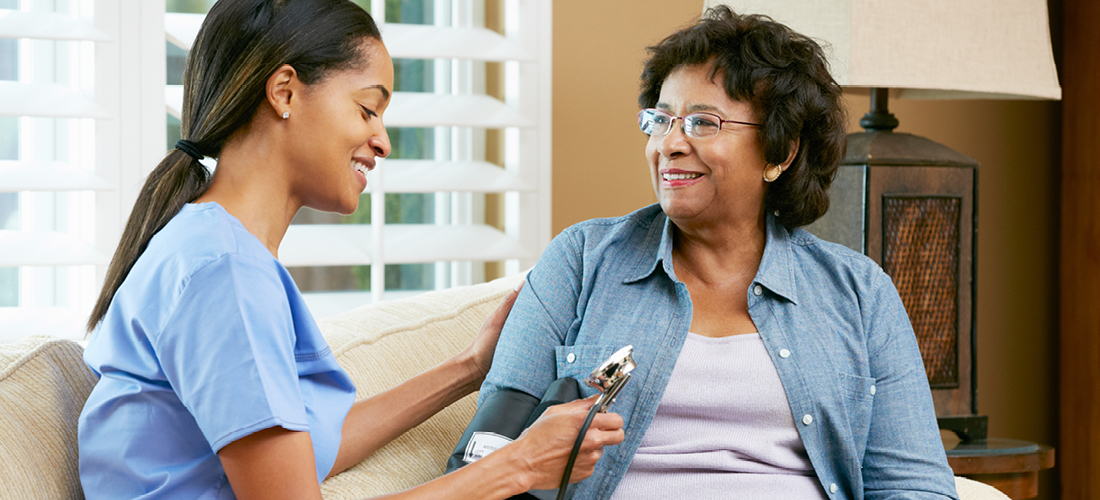 Visiting nurse taking care of a patient , home Care provider with a patient | Doylestown Health