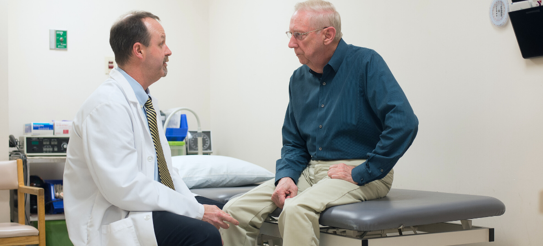 Doctor consulting with a Male patient| Doylestown Health 
