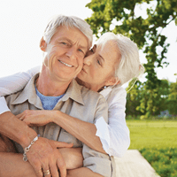 Couple hugging near a tree | Doylestown Health