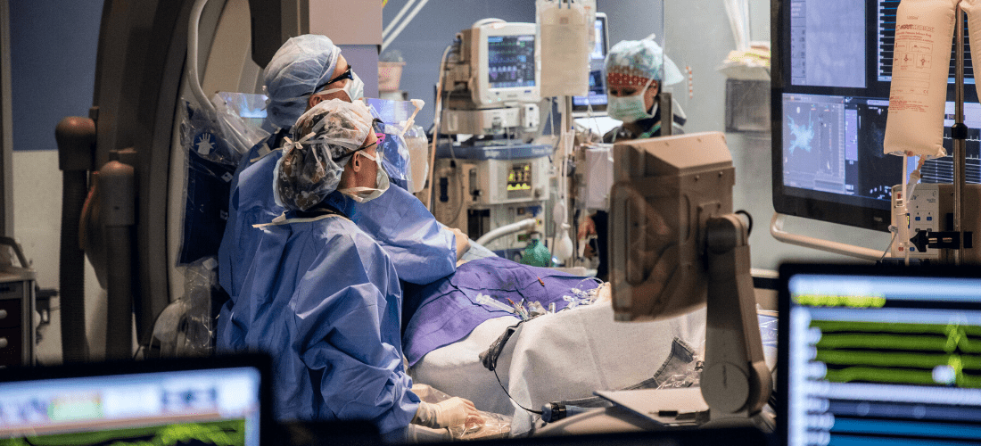 Two providers watching a screen in the operating room | Doylestown Health
