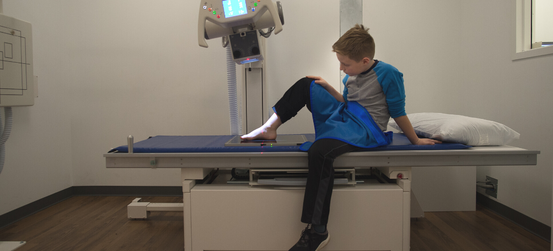 Child examining injury on his leg | Doylestown Health